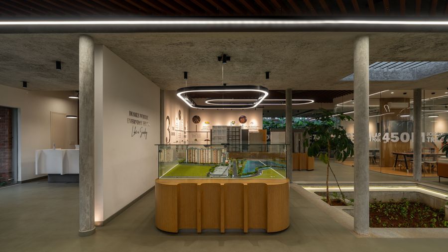 Reception area with layered ring pendants