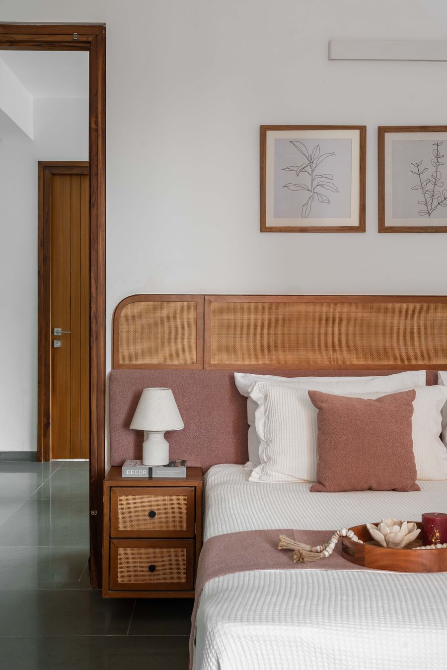 Bedroom with rust-toned upholstered headboard