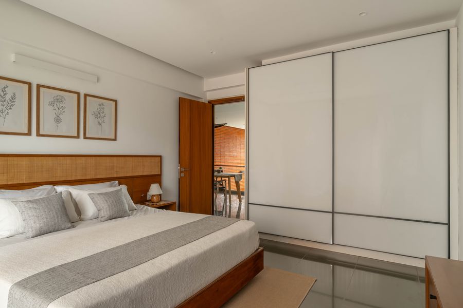 Bedroom storage wall with open shelving