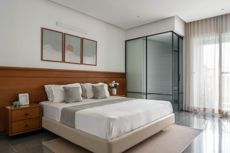 Bedroom with teal panelled headboard wall