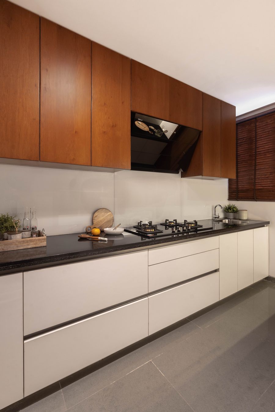 Kitchen with warm wood and white cabinetry