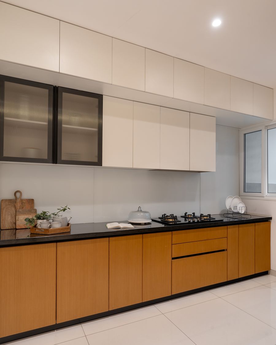 Kitchen counter with black granite and warm cabinetry